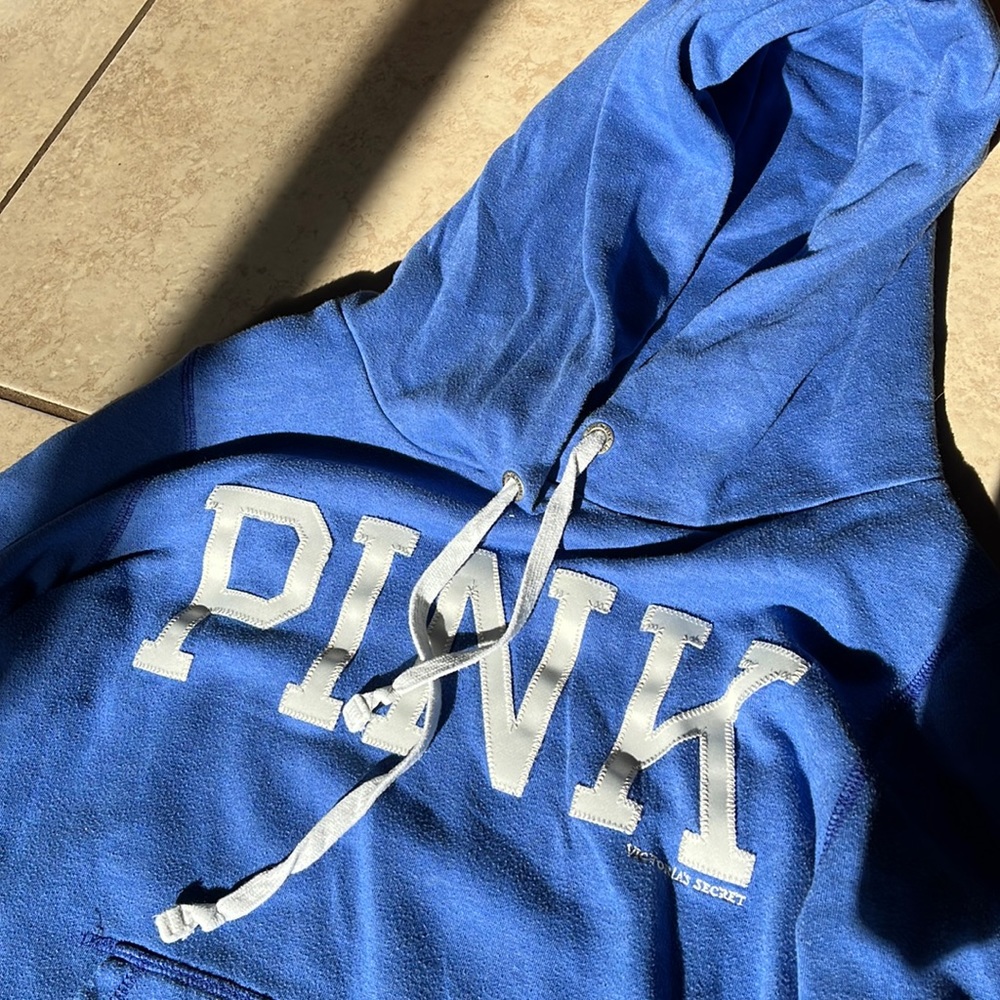A blue PINK Victoria secret hoodie in the size youth large